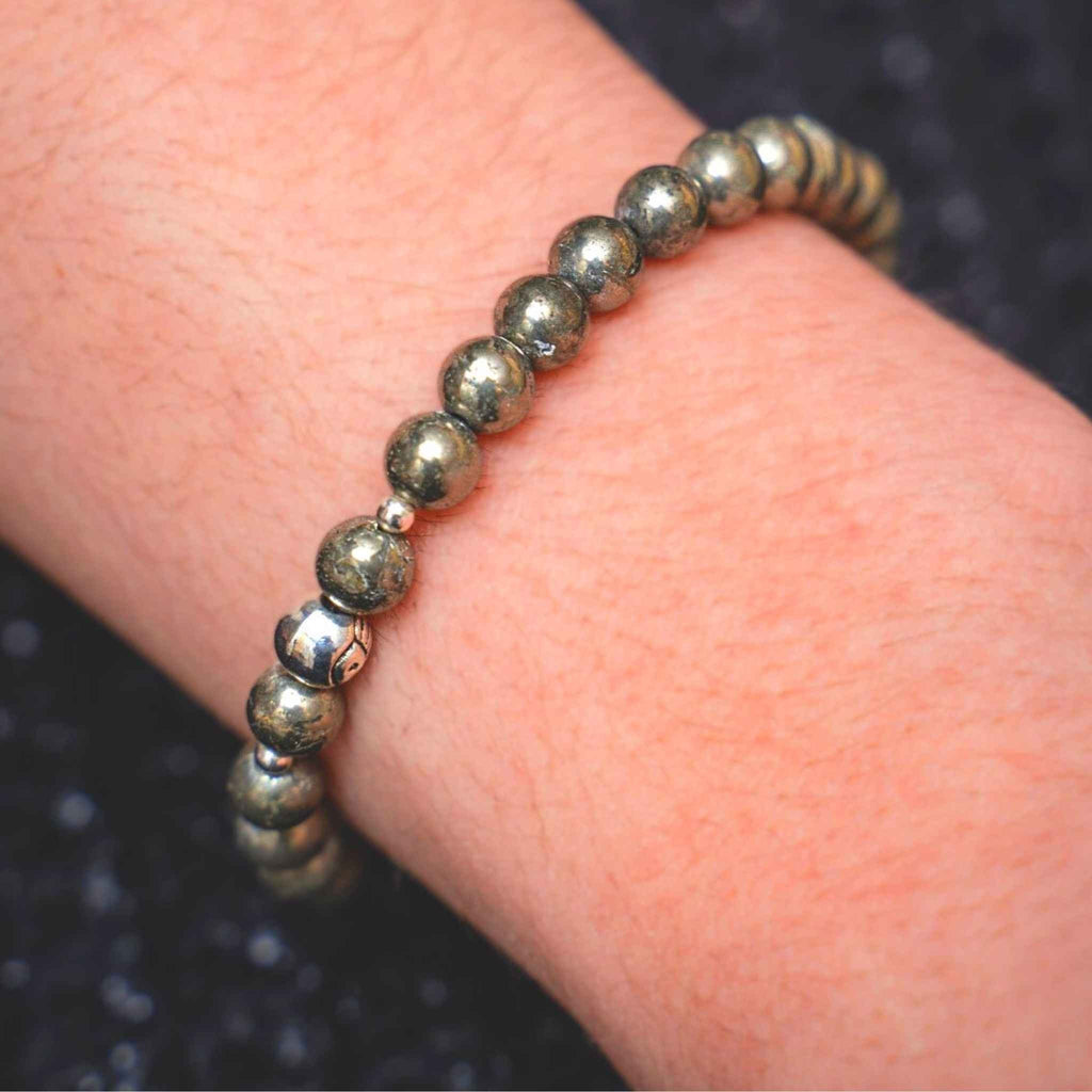 You are viewing a - High Quality Round Smooth Gemstone beaded bracelet. This is a great stacking bracelet! This bracelet has 6mm pyrite gemstones Approx 7.5&quot; This bracelet fits most and is on an elastic band for a perfect fit!