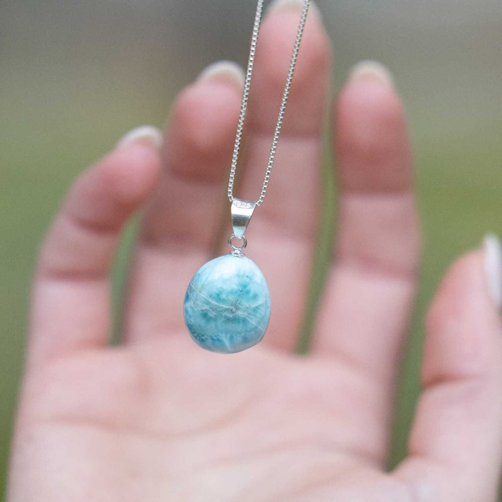 Unique Tranquil Larimar Crystal Necklace - This lovely necklace is on a sterling silver 18 inch chain. Pendant measures 1 inch 1.35 from the bottom of the stone to the top of the swinging bale.