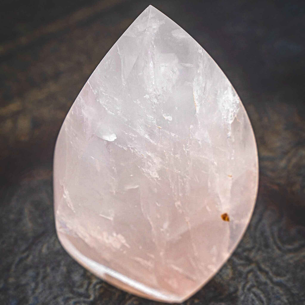 AAA Grade Natural Rose Quartz Flame - Crystal Flame High-Quality Polished - The Stone of Universal & Unconditional Love&quot;. Symbolizes: Love, Kindness, & Femininity Crystal Specifications Height: 5 x 1 1/2&quot; Weight: .505 g.