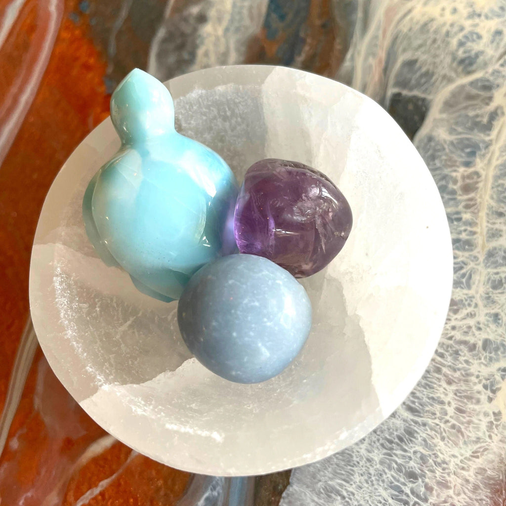 You are viewing Serenity Selenite cleansing bowl set ( 2 Variations) The Serenity Bowl Set Includes: Larimar Turtle, or Larimar Sphere (2 Options Available) 1.5&quot; Round Selenite Bowl 1 Amethyst Tumble 1 Angelite Tumble