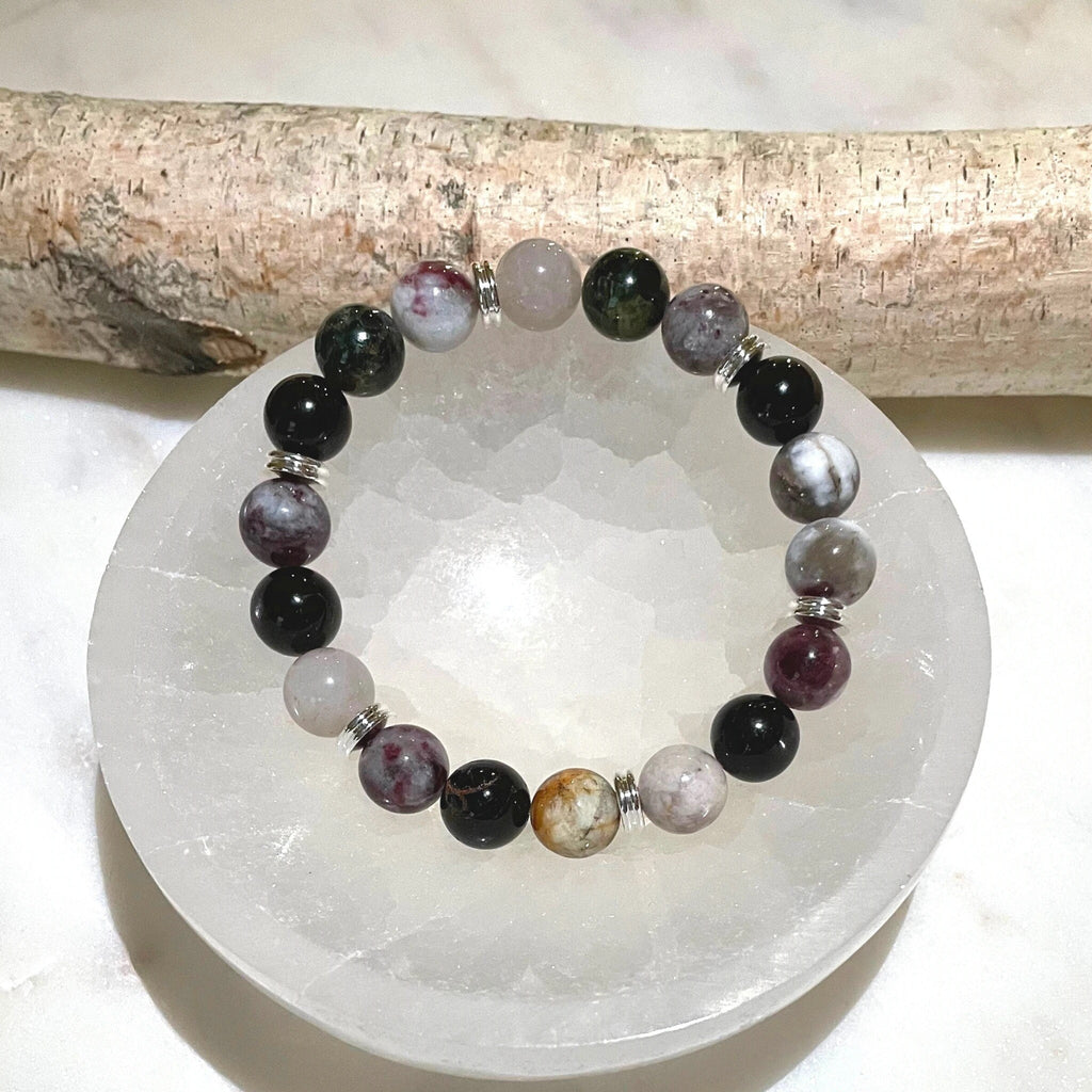 Multi Colored Tourmaline Gemstone Bracelet which is beaded on stretchable nylon. Tourmaline Healing Properties: Symbolizes Compassion Promotes understanding and tolerance Features: 10mm bracelet Includes round Selenite bowl!