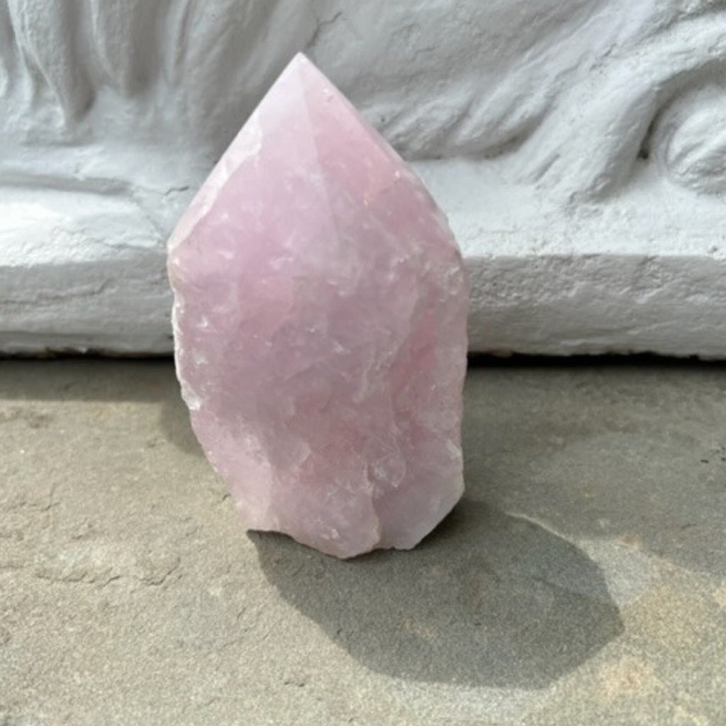 This unique Rose Quartz Crystal is the stone that opens the heart chakra and promotes healthy and harmonious relationships of all kind. It is a rose quartz point, half rough and half smooth. 5 inches x 3 inches. weight: 1.47 lbs