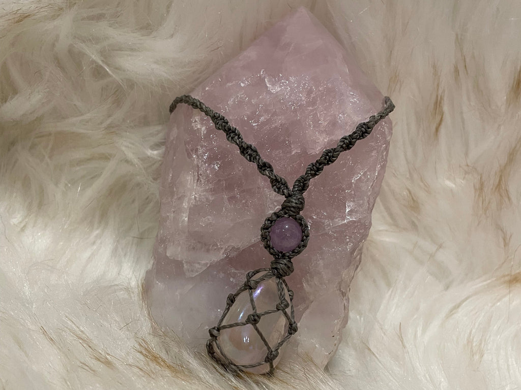 Necklace is handcrafted using Aura Rose Quartz Crystal. It is adjustable and can be worn long or short. It is made with a strong, smooth waxed Charcoal Cord.