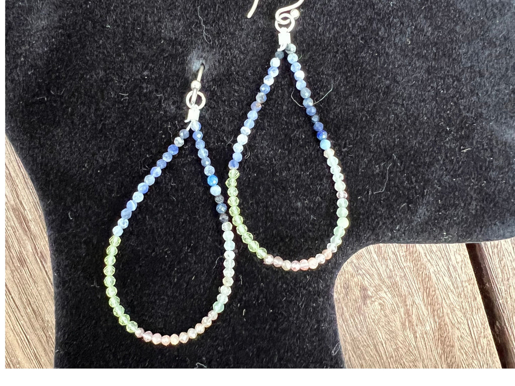 These faceted Multi-Hued Sapphire earrings are hand made of 3MM African beads with gold vermeil (over Sterling Silver) ear wires. The size of the teardrops is 2 inches by 1 1/4. These earrings are hand-knotted.