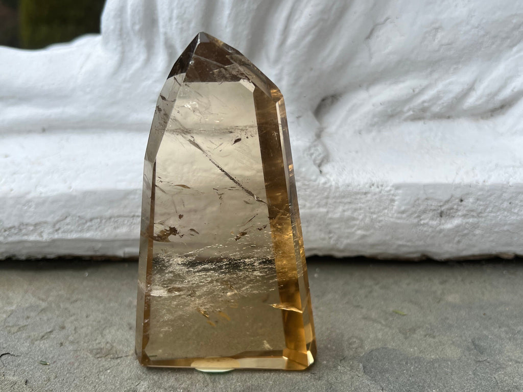 Your Genuine Natural Citrine Tower is a AAA quality Honey Point, highest Grade Honey Citrine from Brazil. Height: 5 Width: 3/4 weight: .65lbs, .29 k Healing Properties:Citrine is a stone of joy, abundance, success.