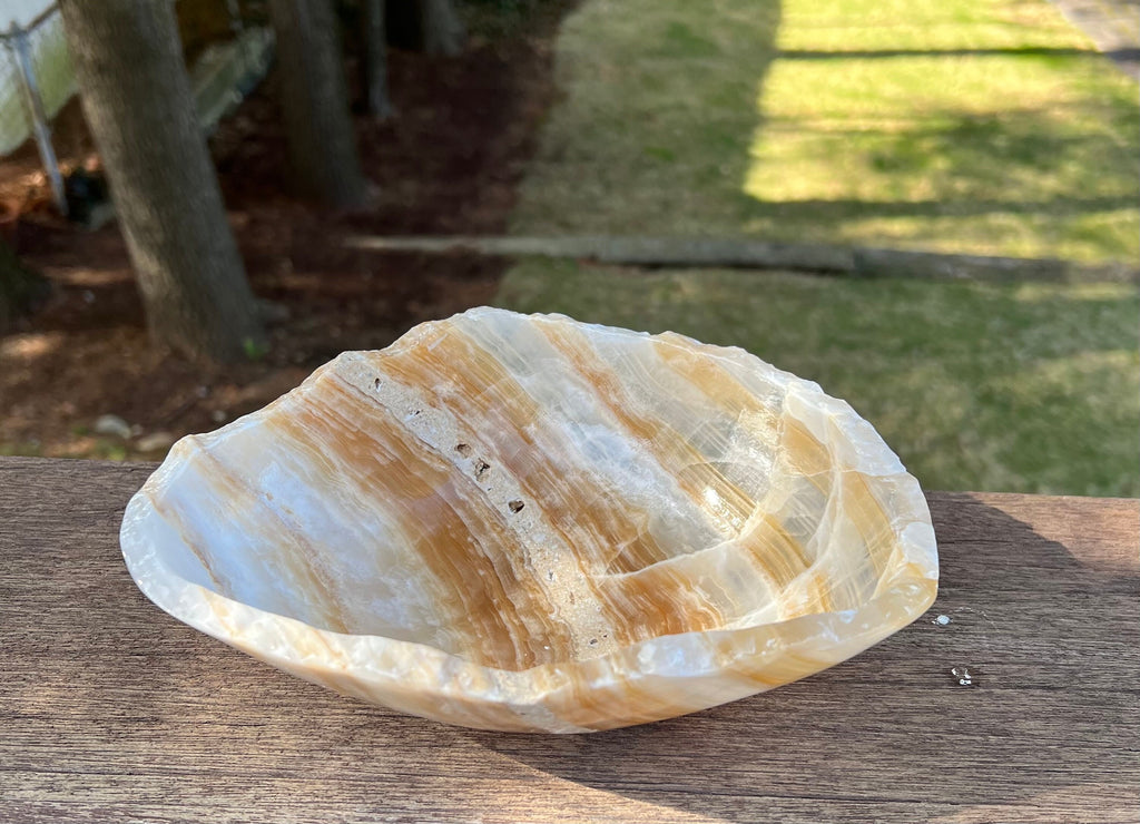 Natural Stone Onyx Bowl A light polish finish hand-carved natural Stone Crystal Bowl with smooth irregular edges. This is a Decorative Crystal Rock Bowl that is both elegant and rustic.